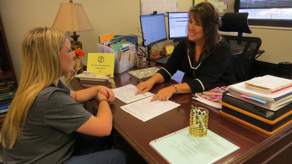 Advisor helping student