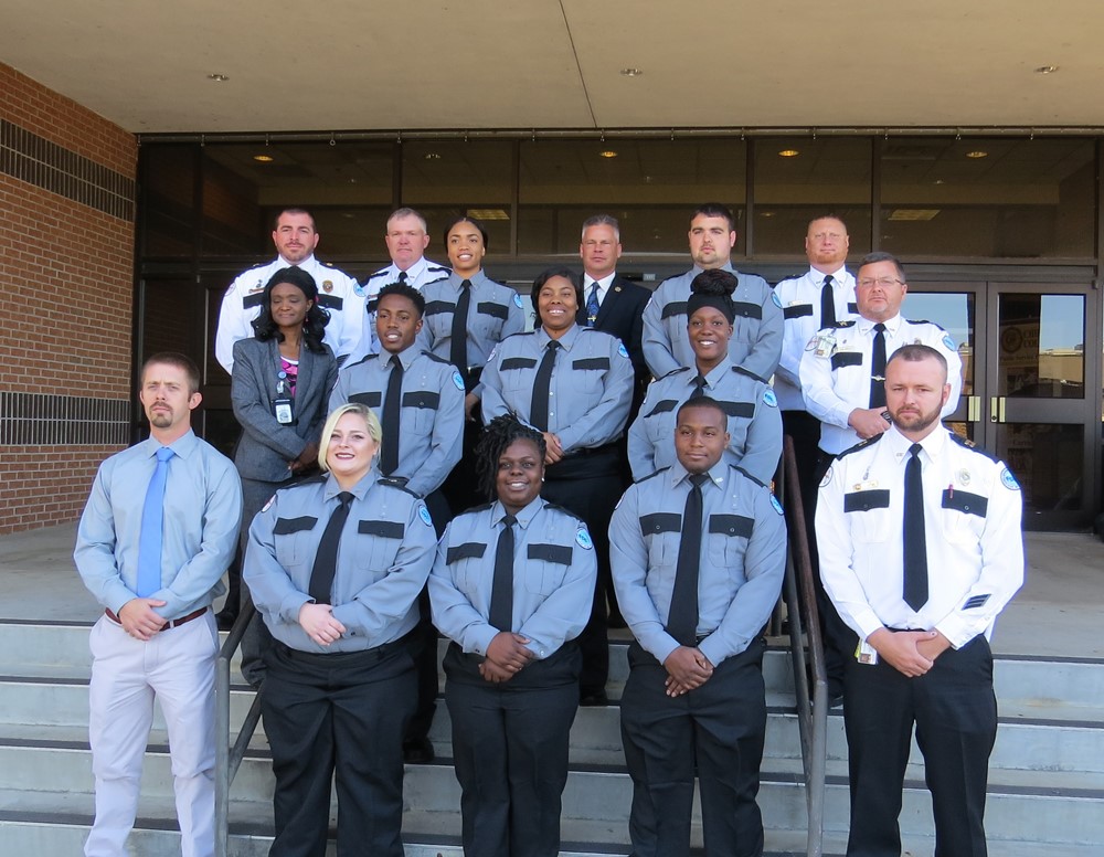 Corrections grads posing